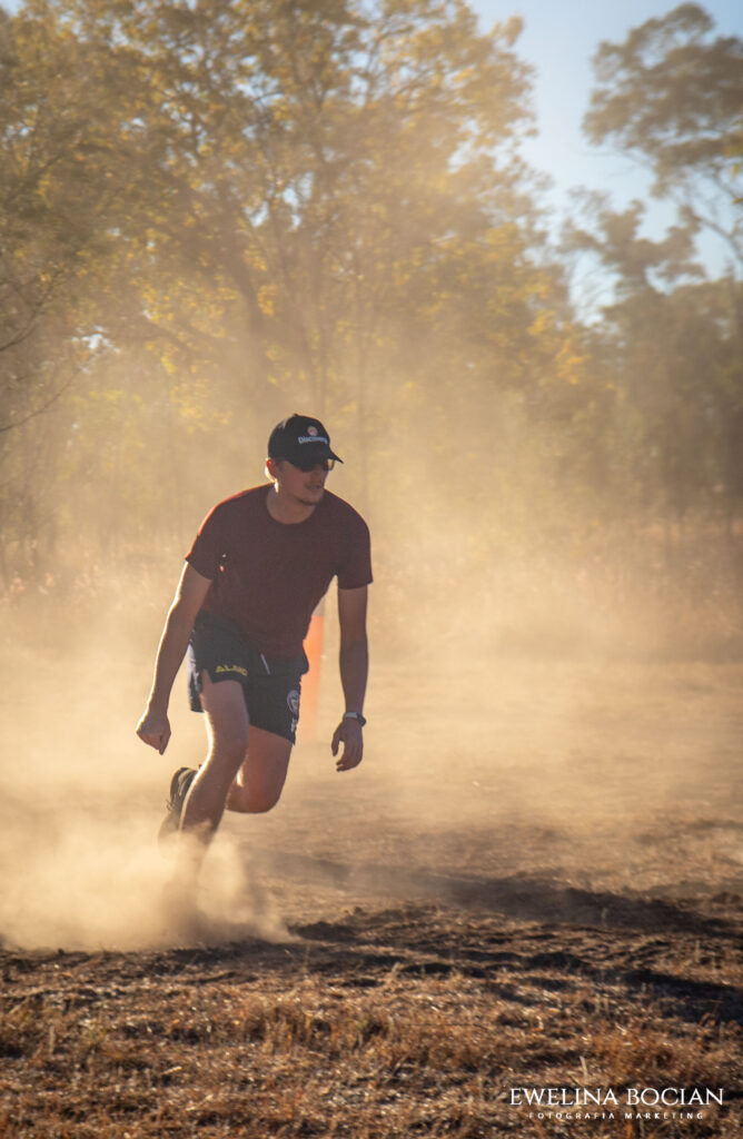 Man from the dust running for ball